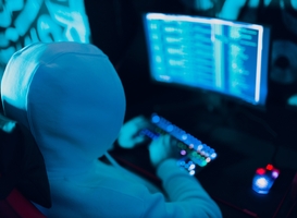 Normal_hacker-in-hoodie-working-hacks-code-site-on-person-2022-11-16-12-02-28-utc