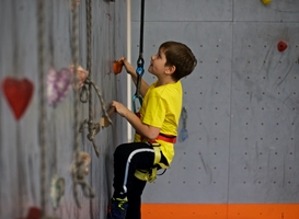 Normal_young-boy-climbing-a-wall-at-an-indoor-rock-climbi-2022-11-10-18-26-59-utc